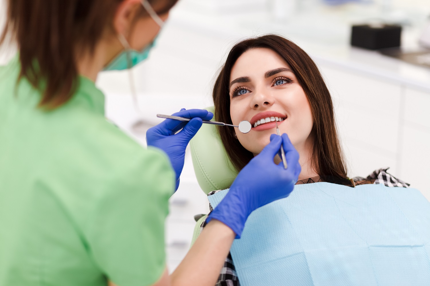 Patient undergoing a dental evaluation at Sunrise Dental Clinic in Gig Harbor, WA for a healthy, confident smile