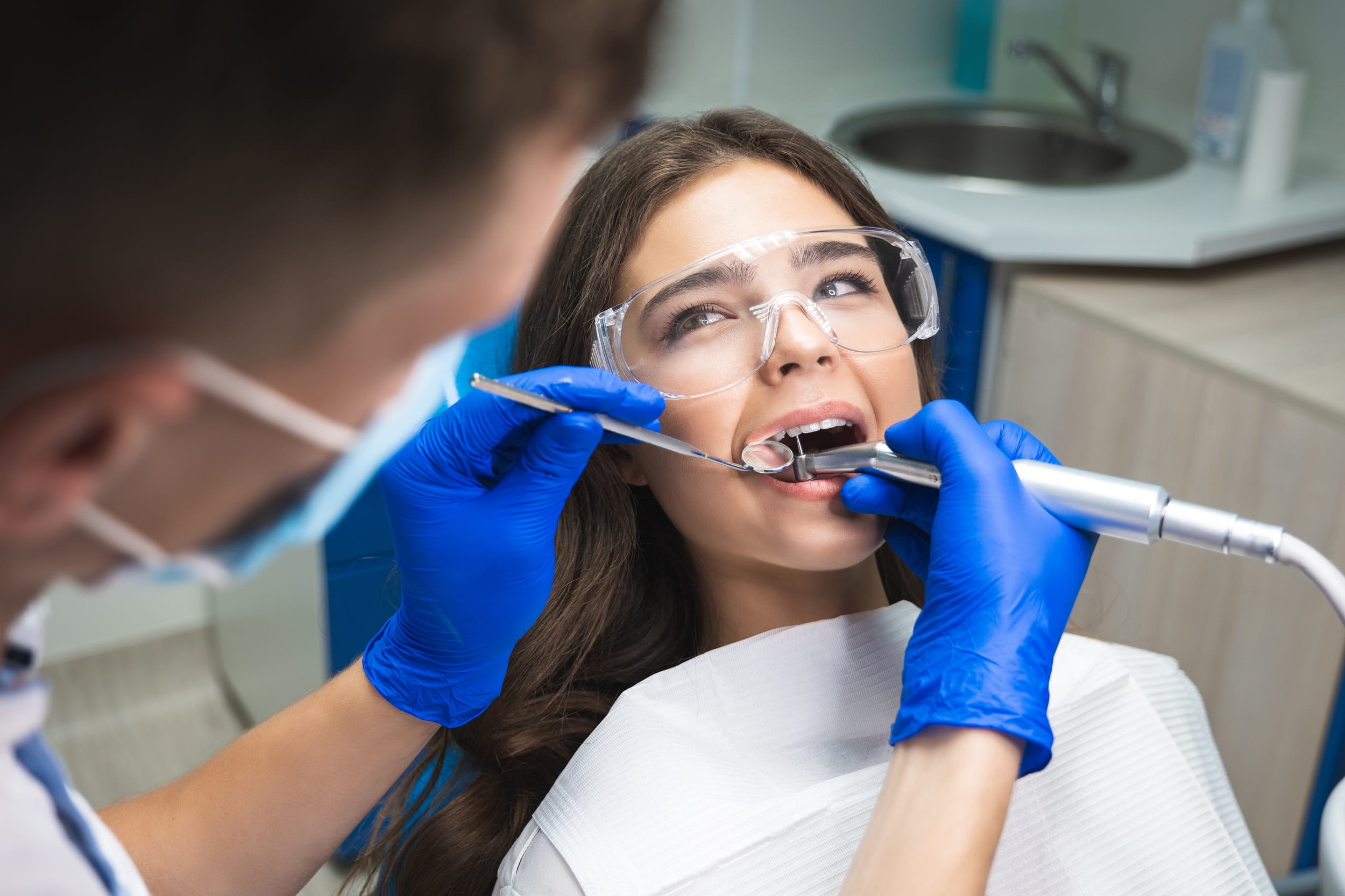Patient receiving a root canal treatment at Sunrise Dental Clinic in Gig Harbor, WA for a healthy, pain-free smile